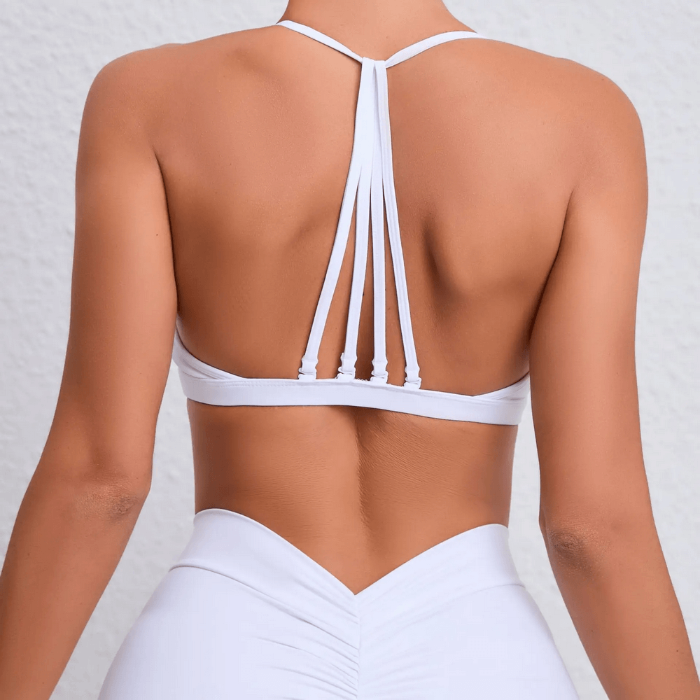 Back view of chic multi-strap sports bra SF2468 with elegant strappy design, perfect for yoga, running, or fitness activities.